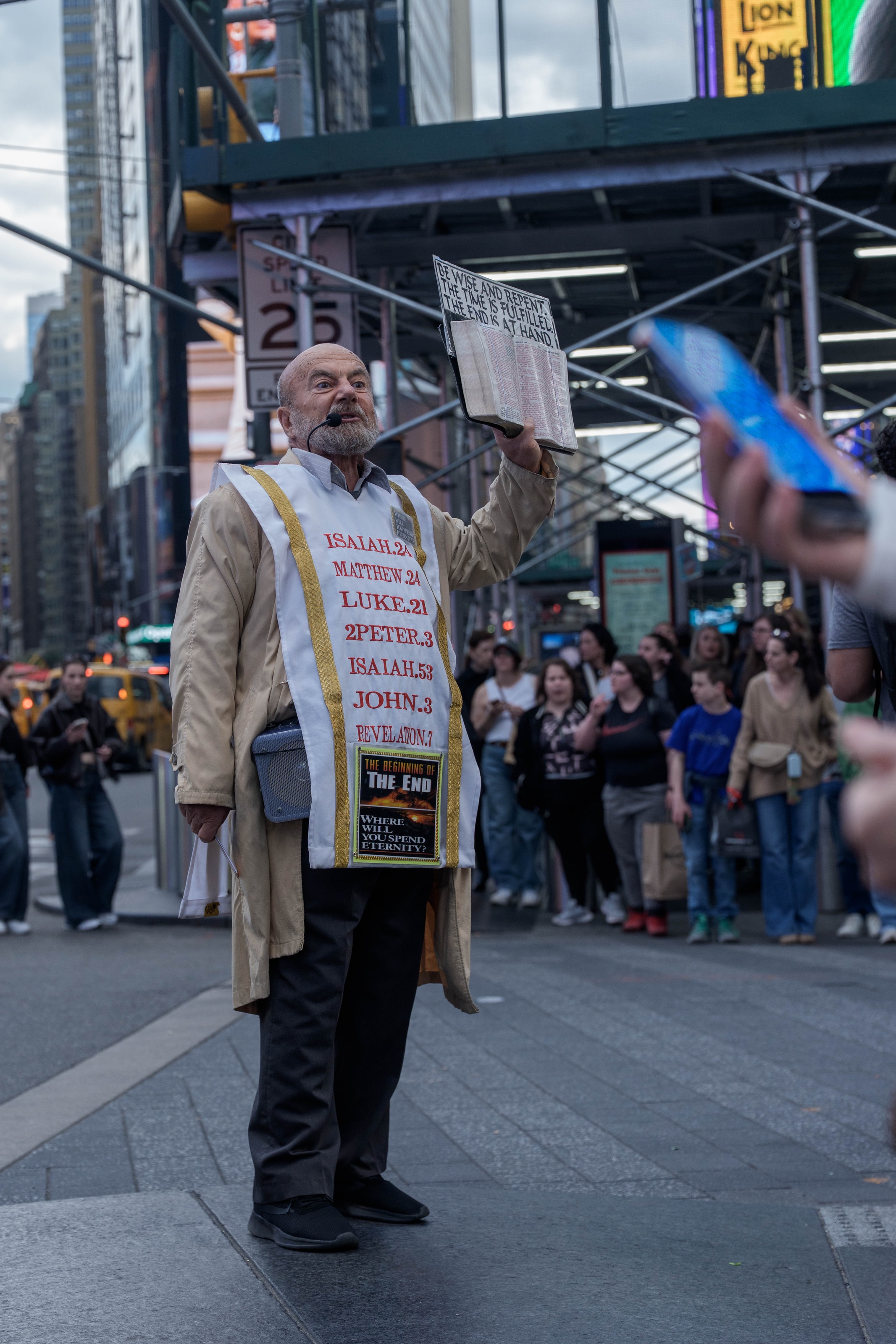 An independent street evangelist shares the Christian gospel in Times Square.